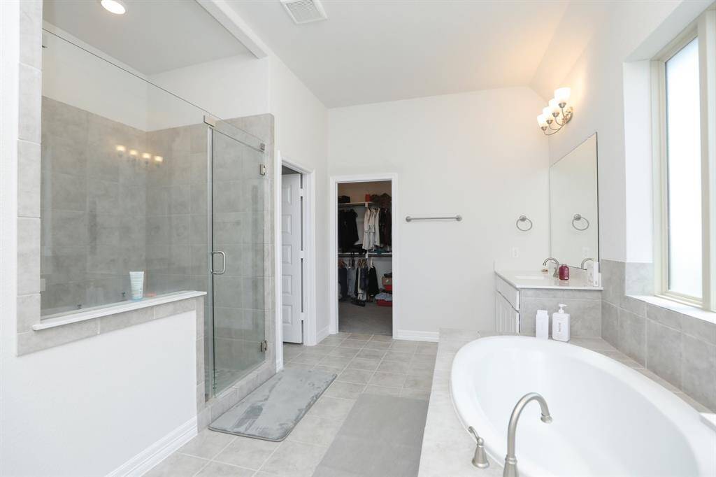 Another view of the Soaking Tub and walk in Shower in Primary upstairs.
