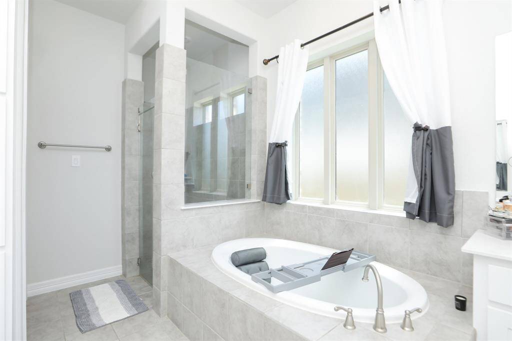 Soaking Tub in downstairs primary for those bubble baths.