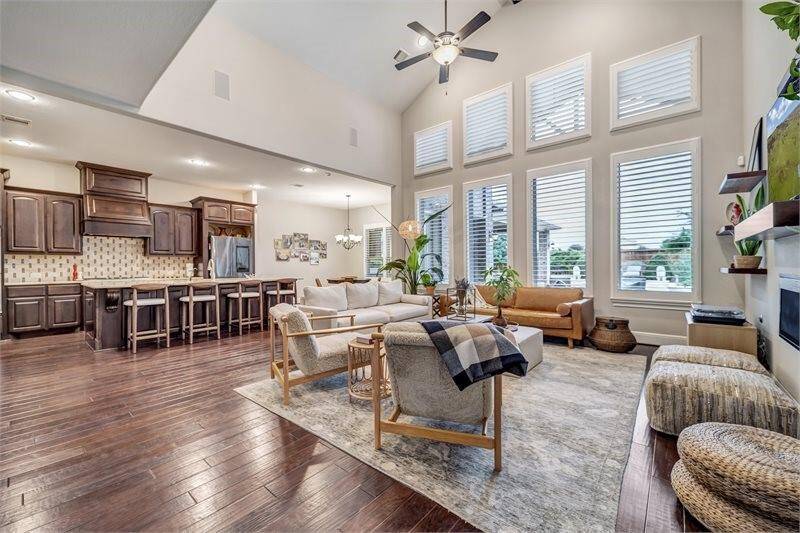 With high ceilings, this residence is illuminated by large windows.