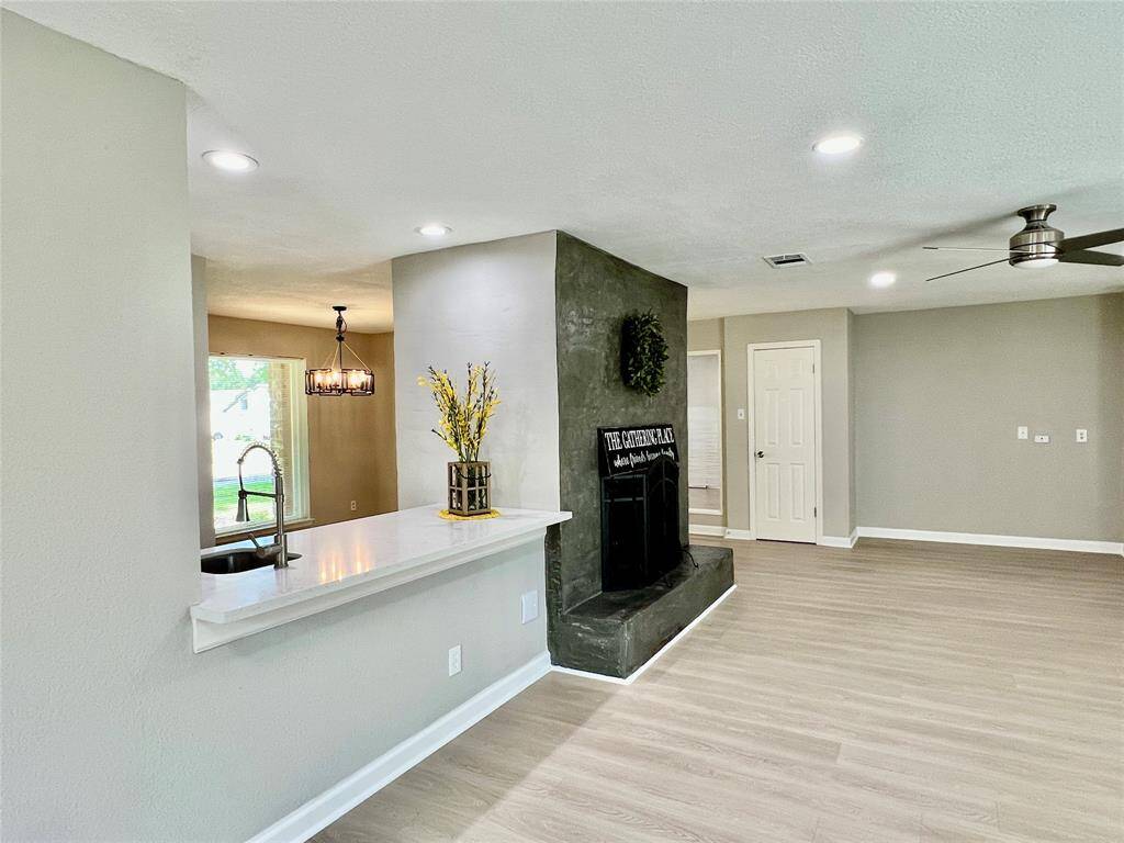 View of the fire place and wet bar