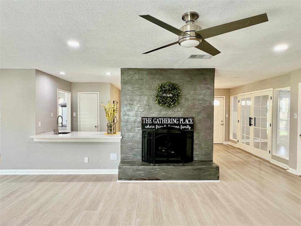 View of the fire place and wet bar