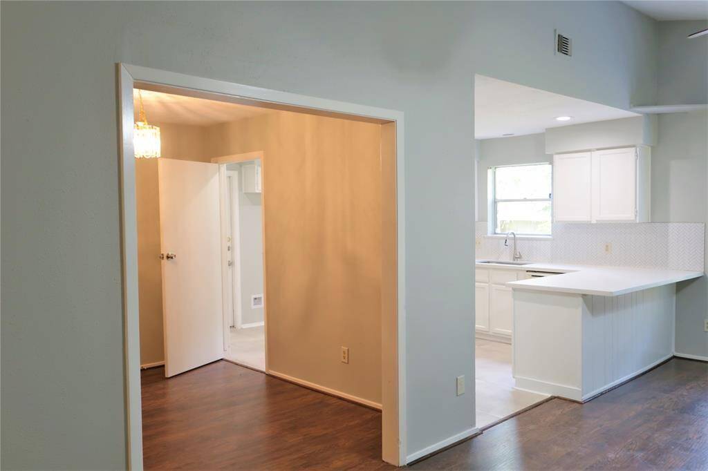 VIEW OF DINNING ROOM OFF KITCHEN