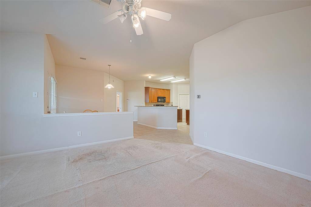 From this vantage point, the flow between the living room, kitchen, and breakfast nook becomes clear—each area distinct, yet thoughtfully connected for ease and conversation.