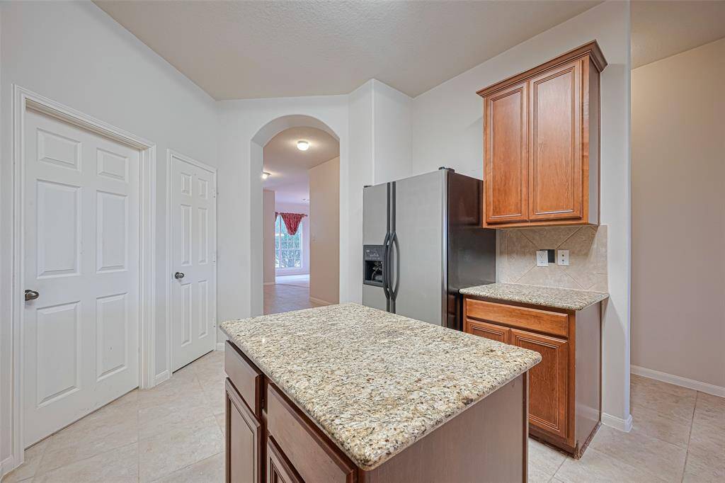 A smartly placed passage gives the kitchen direct access to the dining room, adding convenience to both casual meals and more formal gatherings.