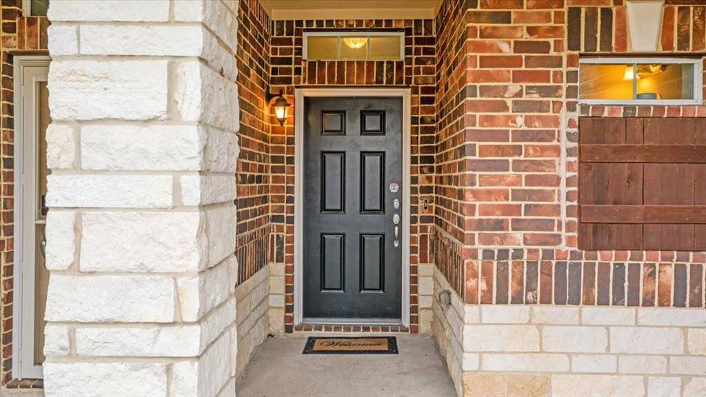 Classic brick entrance adds timeless curb appeal