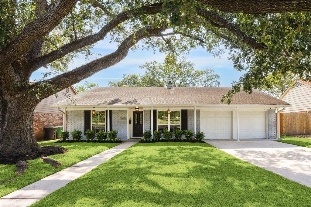 Beautiful curb appeal in this updated traditional with new landscaping and lush, green grass.