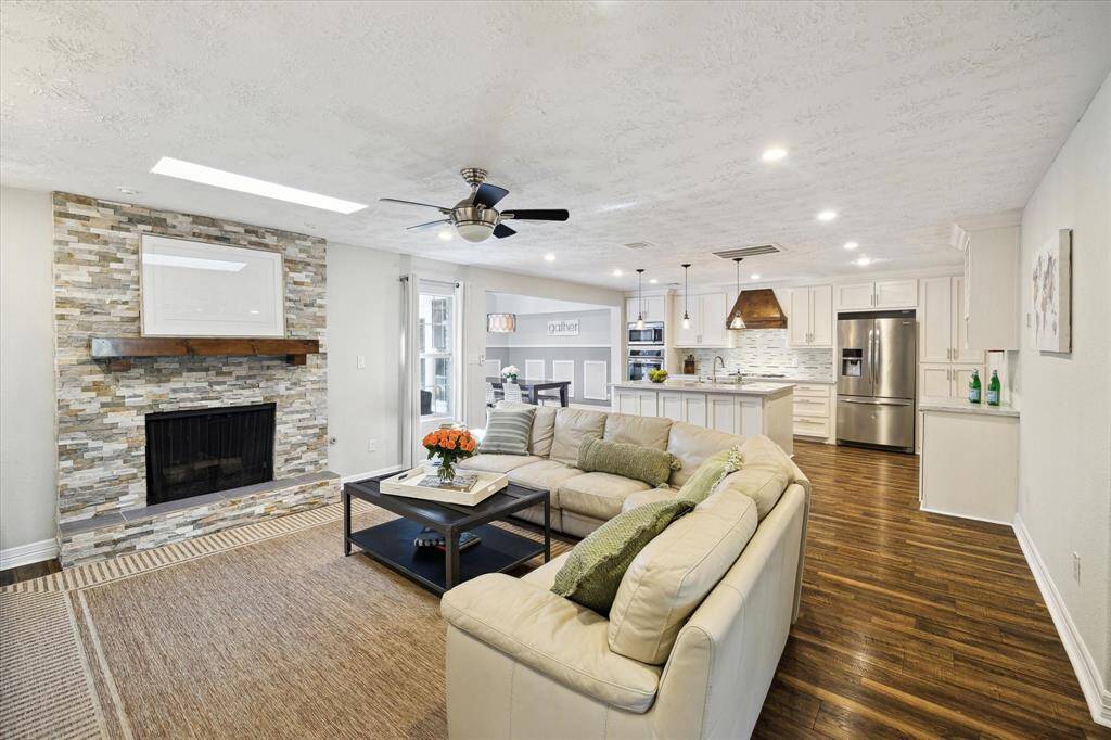 The beautiful stone fireplace adds a cozy yet modern touch.