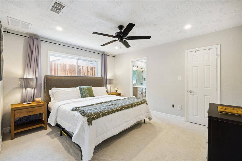 Primary bedroom features new carpet, huge walk-in closet and an ensuite bathroom.