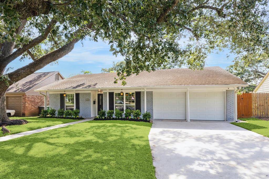 The home features attached 2 car garage with double wide driveway for additional parking.
