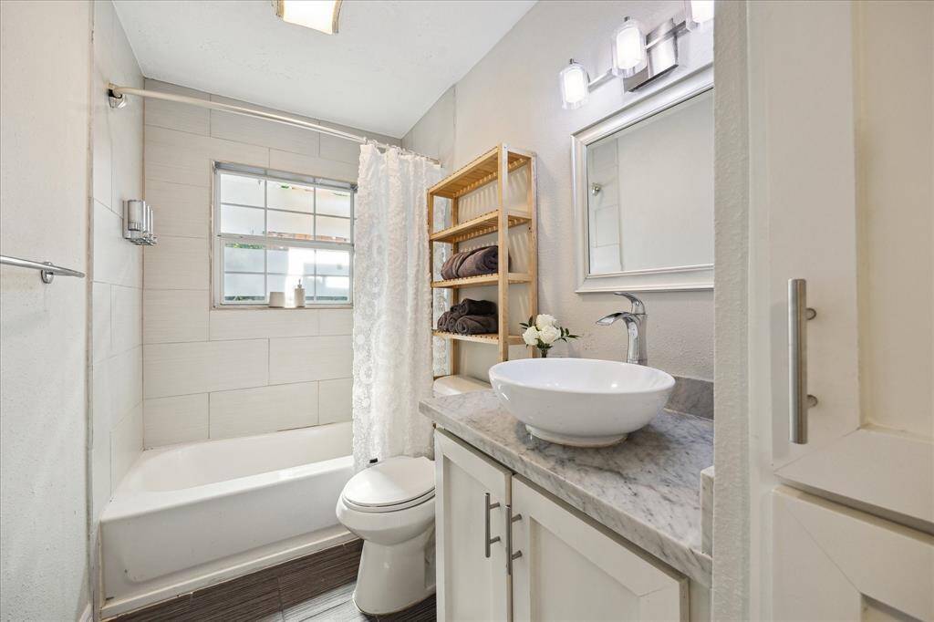 Secondary bathroom features marble counters.