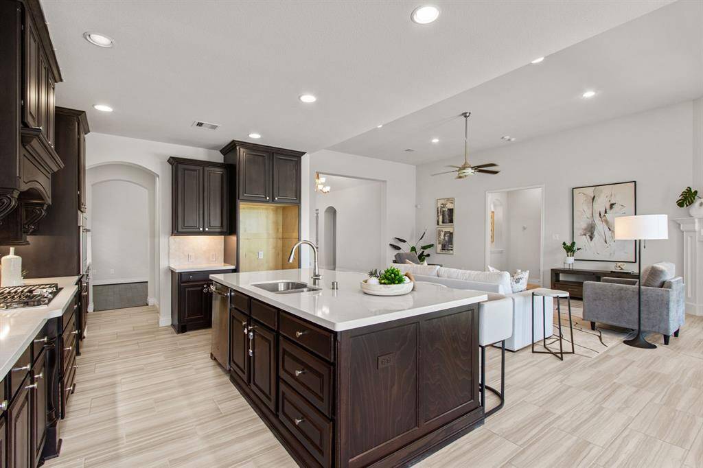 Island kitchen with granite countertops.