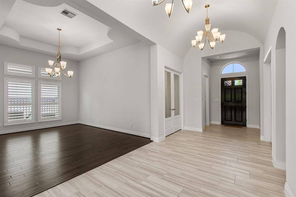 As you enter, you'll find a dedicated study, spacious game room, and formal dining.