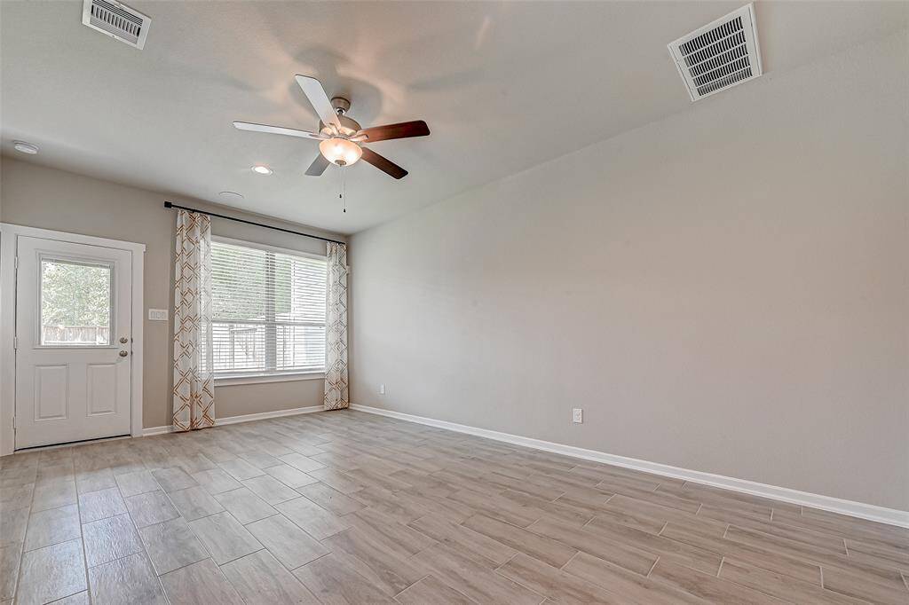 Downstairs game room with access door to the backyard