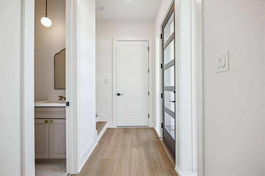 Entryway into the home (door pictured center), access to the attached two car garage to protect you from the elements
