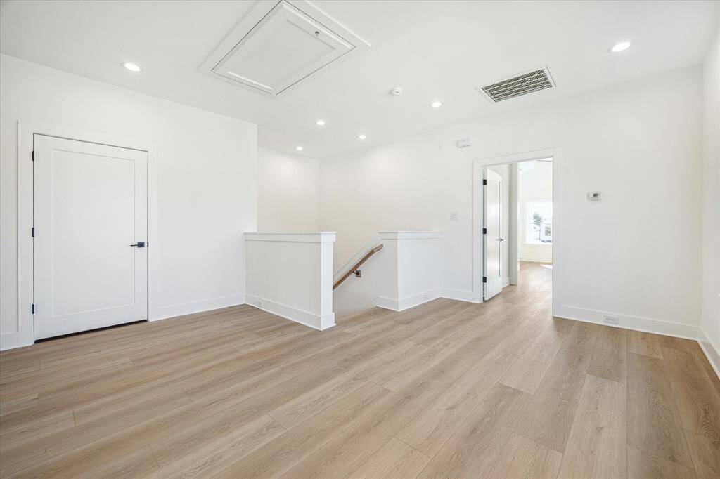 Enter the second floor which offers flex space for sitting area or game room. Walk-in utility room pictured left