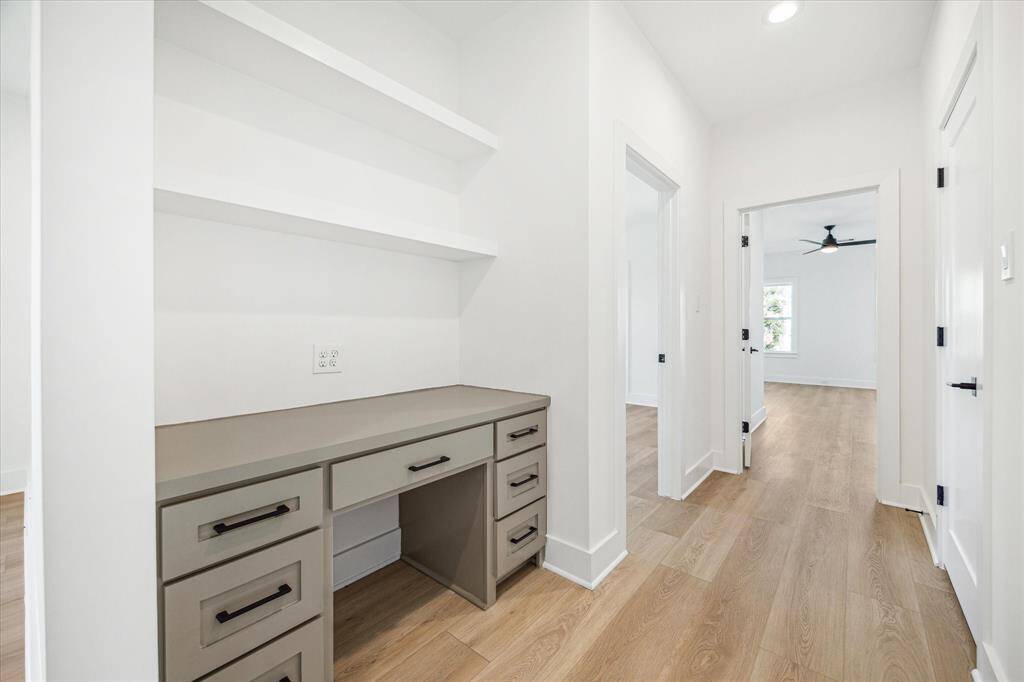 Dedicated second floor built-in desk with shelves, drawers and outlets