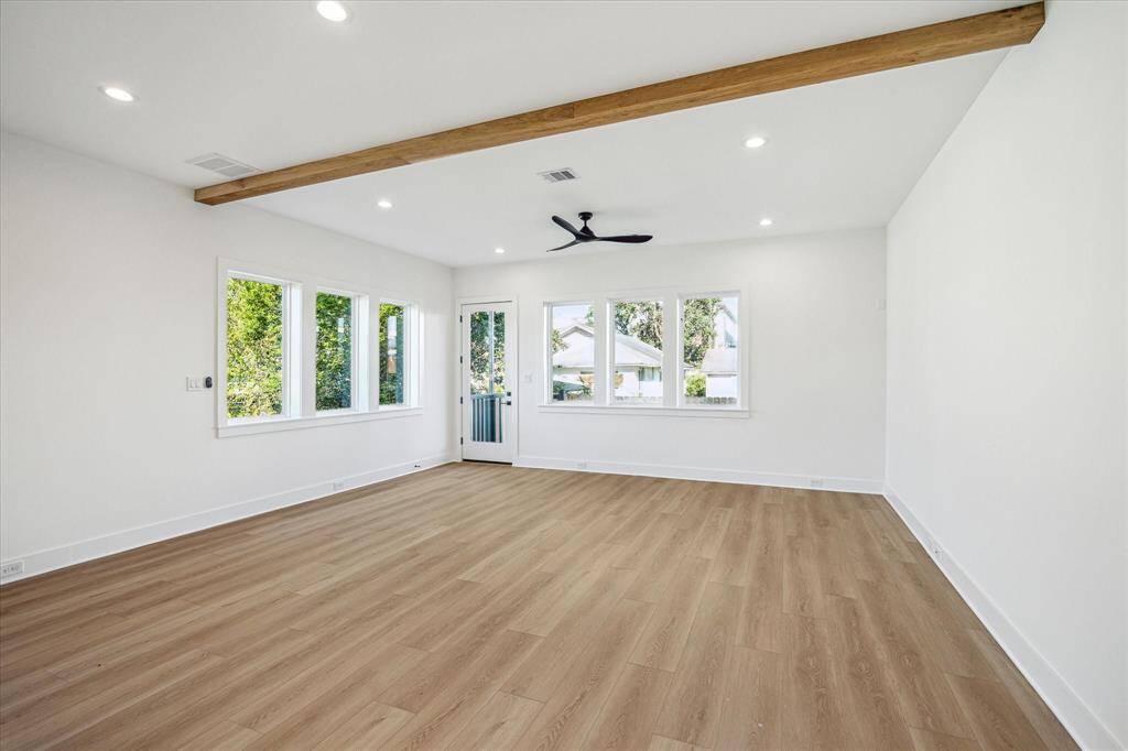Living room, back door transitions to the exterior patio with concrete landing and turf yard space. Enjoy the efficiency of the home and floorplan