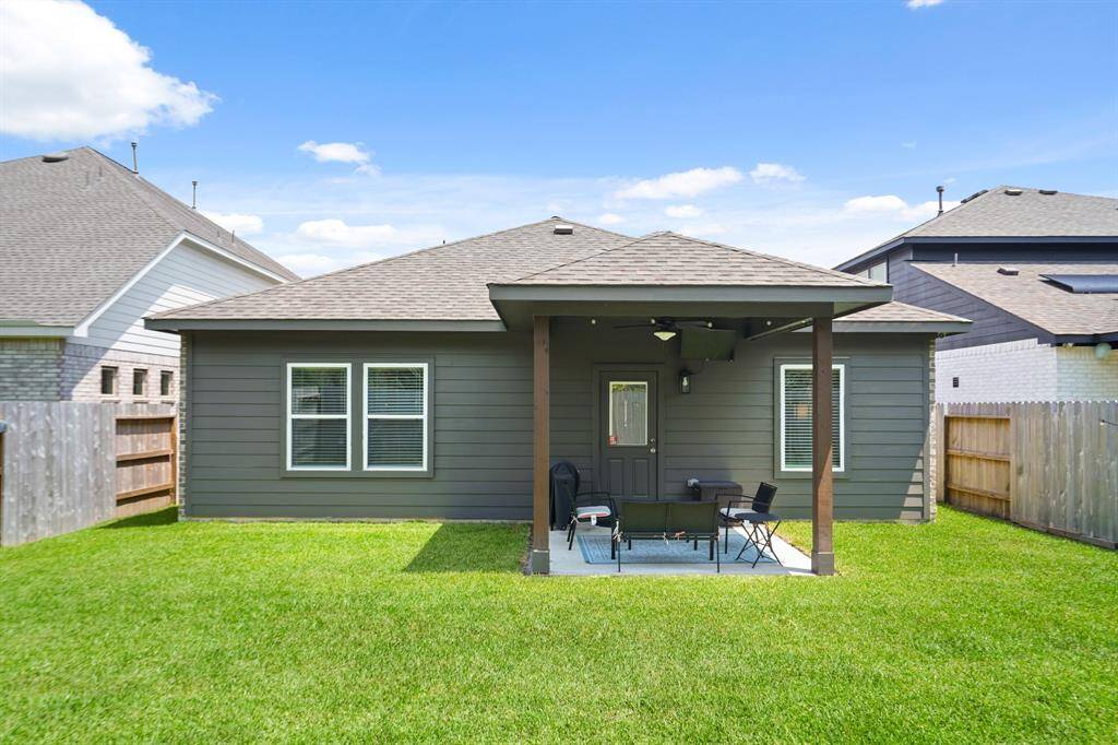 Covered patio with plenty of space to relax or entertain.