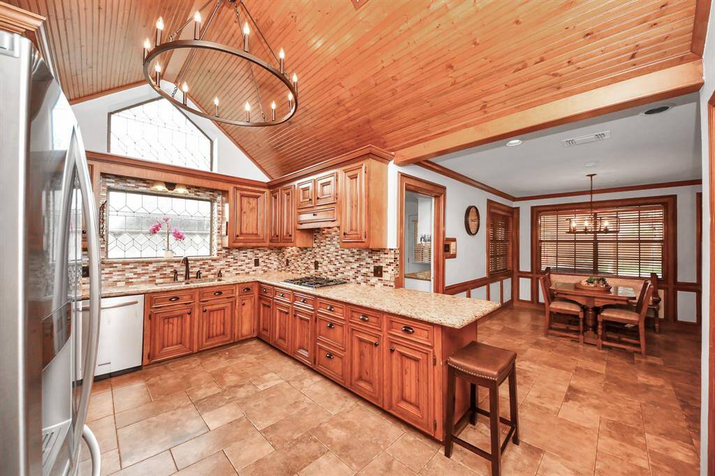We just love the beautiful window details and gorgous ceiling in the remarkable kitchen!
