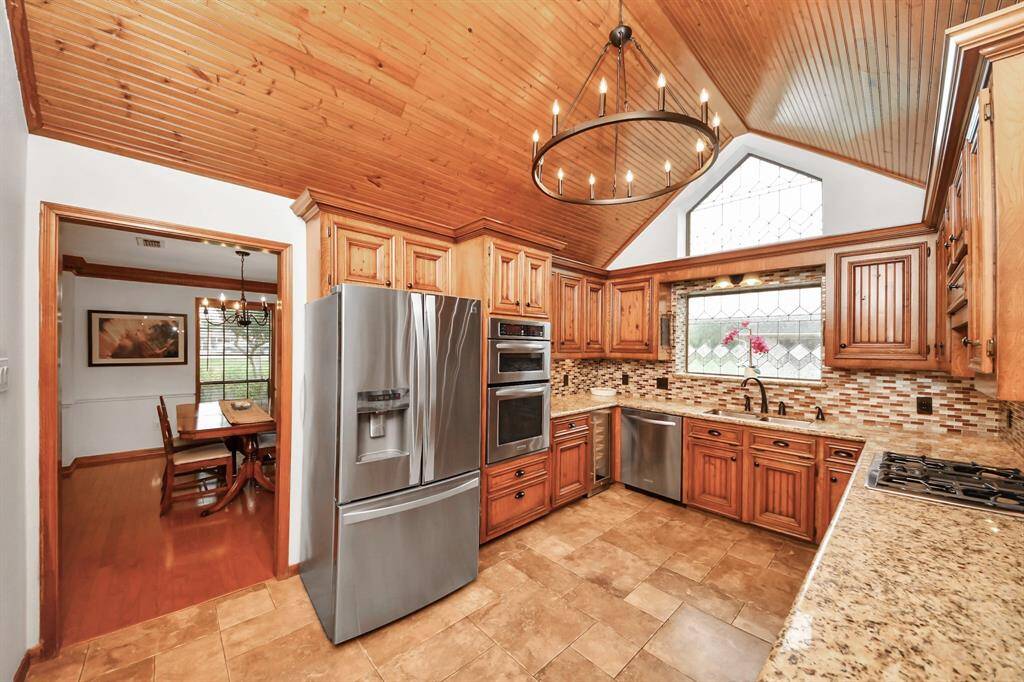This view of the kitchen gives us a glimpse into the elegant dining room!