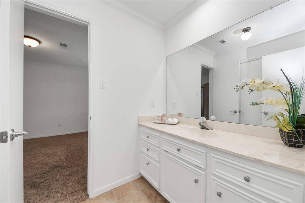 The secondary full bathroom also has wonderful design finishes, and a combination shower & bathtub!