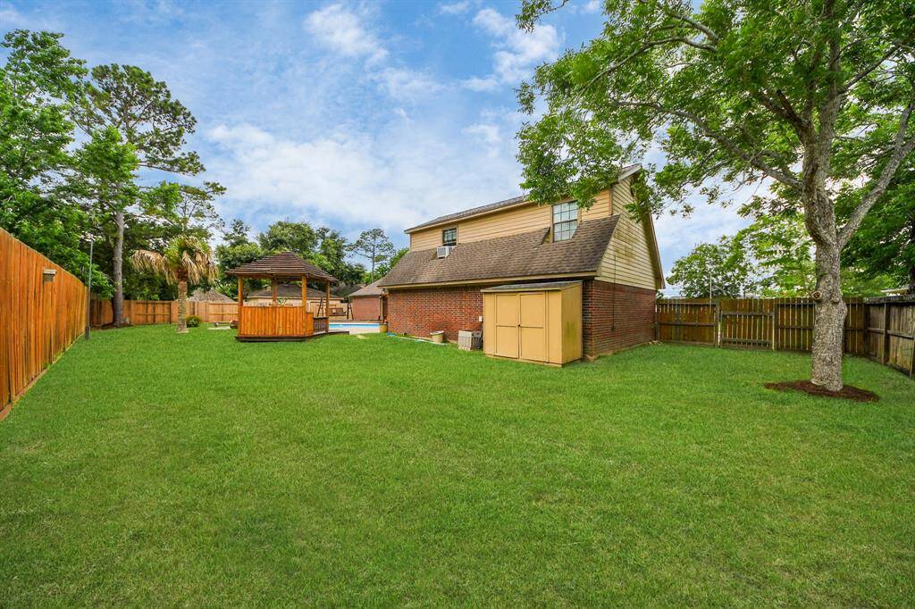 Aside from the fantastic pool area features, this property also offers generously sized lawn space to enjoy!