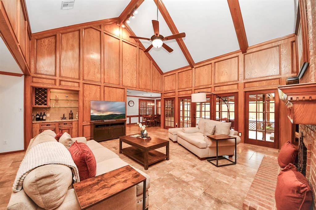 From this vantage point of the living room, we can see the wonderful wet bar with wine storage feature!