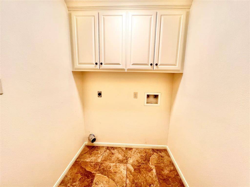 Utility room is in hall outside of Primary suite.