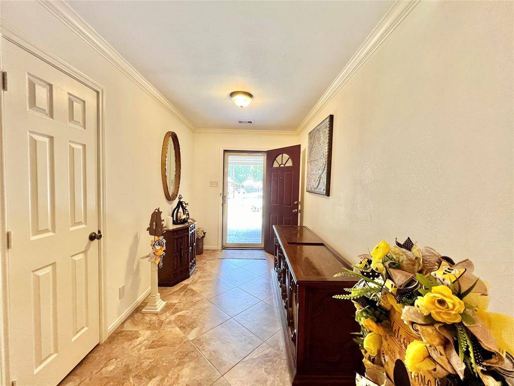 Passing the large Formal Foyer, coat closet on left.