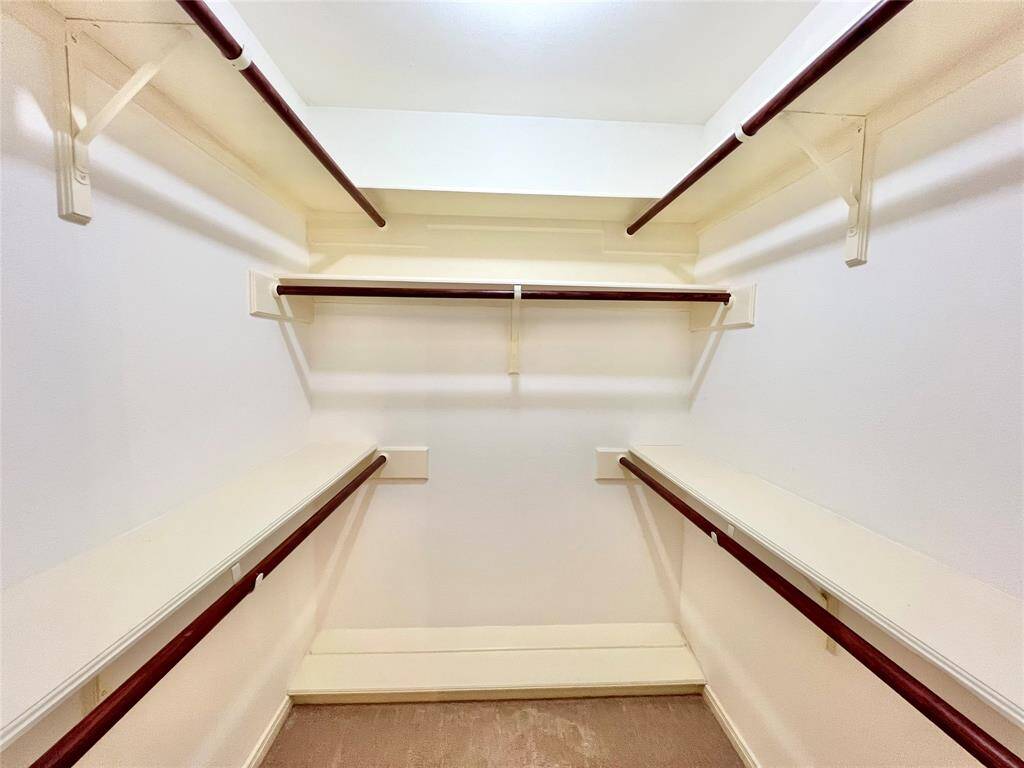 Large walk-in Closet with built in shoe racks again in bedroom #3