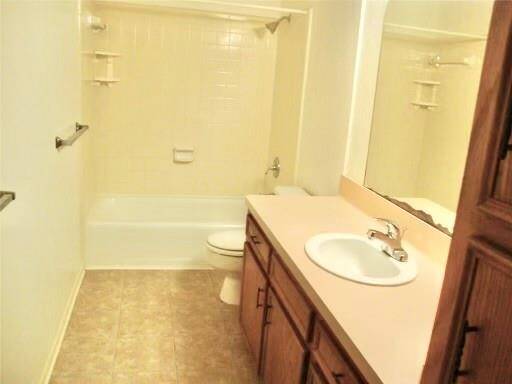 Good sized bath with tiled floors, shower & tub area and lots of storage for linens and towels.