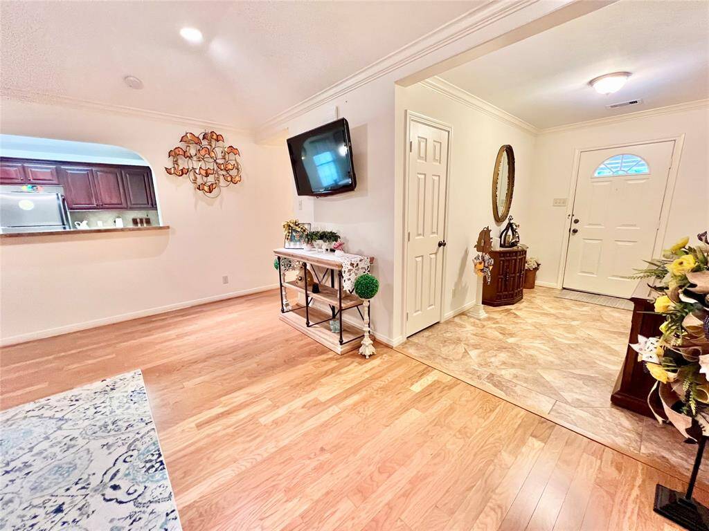 Entering the main home you are greeted with an open floor plan for easy entertaining, high ceilings and beautiful tile and engineered wood flooring in family and large Formal Foyer area.
