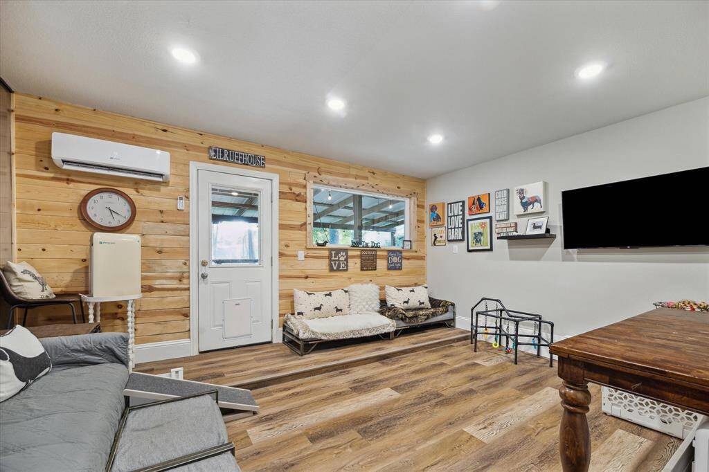 The additional flex room directly connects to the main living area of your home - perfect for your home gym or extra workspace. This room is fully built out with A/C and separate patio access for ultimate comfort.