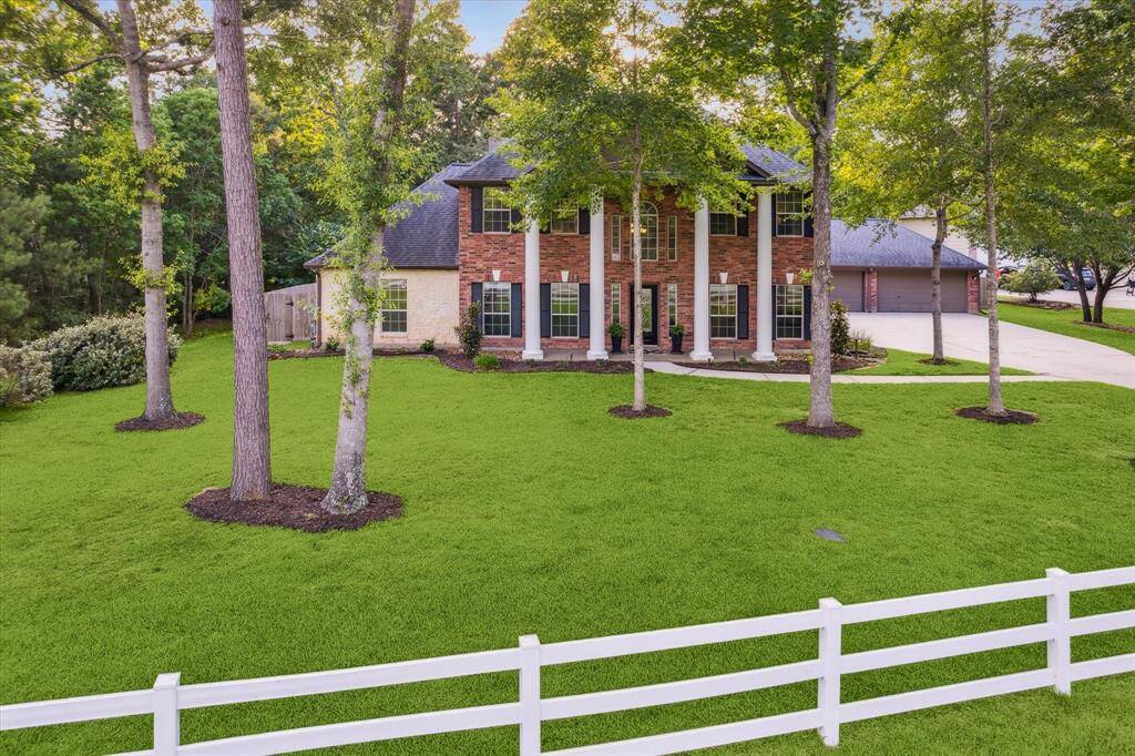 Serene living and tranquil views invite you home on this expansive one-acre waterfront cul-de-sac property.