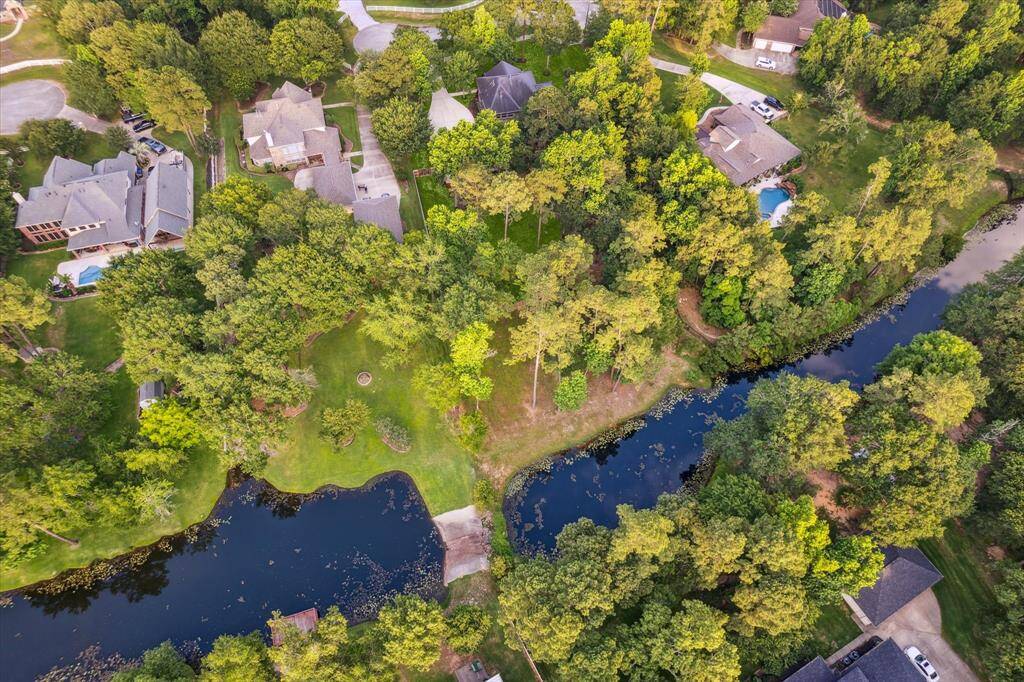Enjoy private lake access just beyond your fully-fenced backyard. Property line extends beyond fencing to lake.