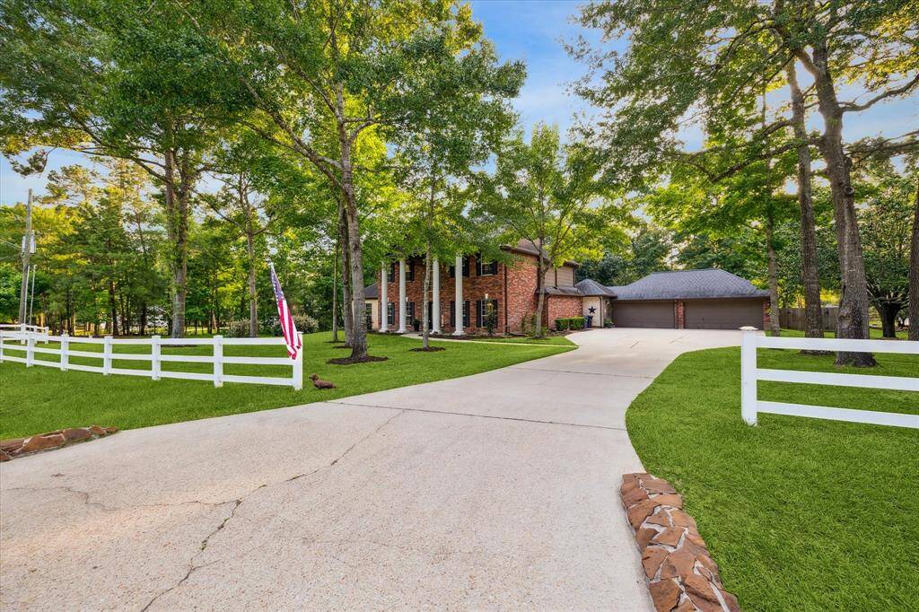 The extended, private driveway offers ample parking and a spacious 2-car garage.