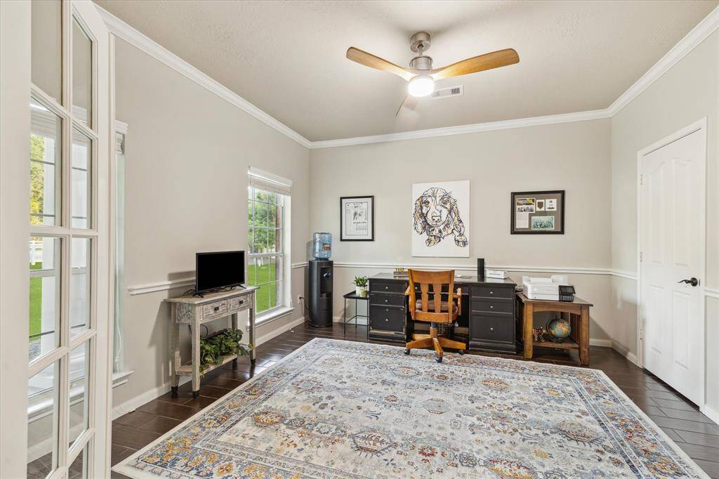 Step into your versatile study, featuring elegant French doors and charming front porch views — perfect for an office or flex space.