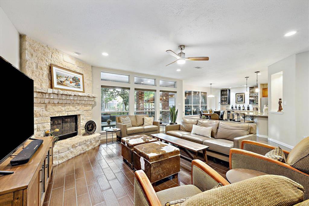 An open layout connects to the kitchen with beautiful bay window views, enhancing the spacious feel and ideal for relaxation and entertainment.