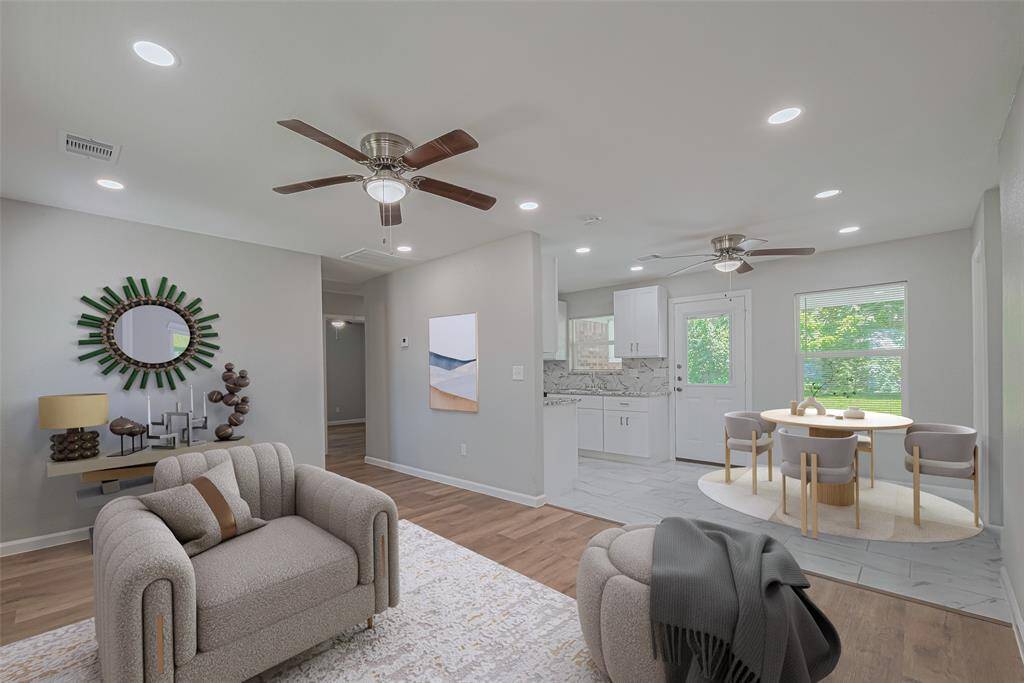 Enjoy a natural transition from the living room to the dining area, with a half wall partially separating the kitchen for visual interest and openness. *virtually staged**