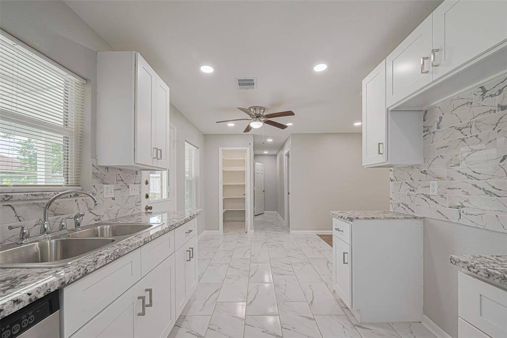 From the kitchen, a clear view of the dining space and pantry emphasizes the practical and connected layout.