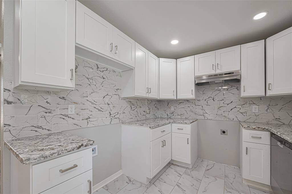 The kitchen offers dedicated spaces for your refrigerator and range, allowing you to personalize with your preferred appliances.
