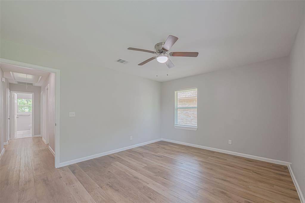 Light-toned flooring and soft neutral walls create a serene ambiance ideal for unwinding at the end of the day.