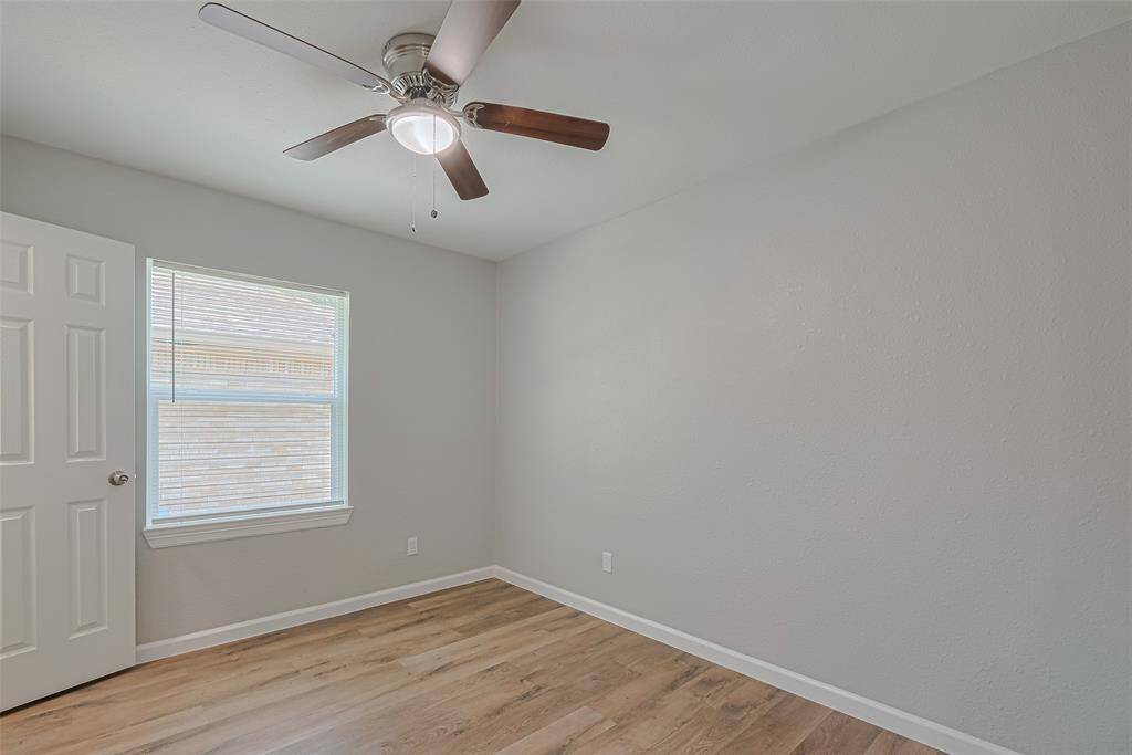 This additional view highlights the light color palette and generous layout that continues throughout the home.