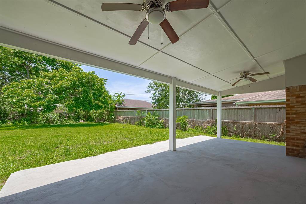 Two ceiling fans help keep this oversized patio cool and comfortable on warm Houston days