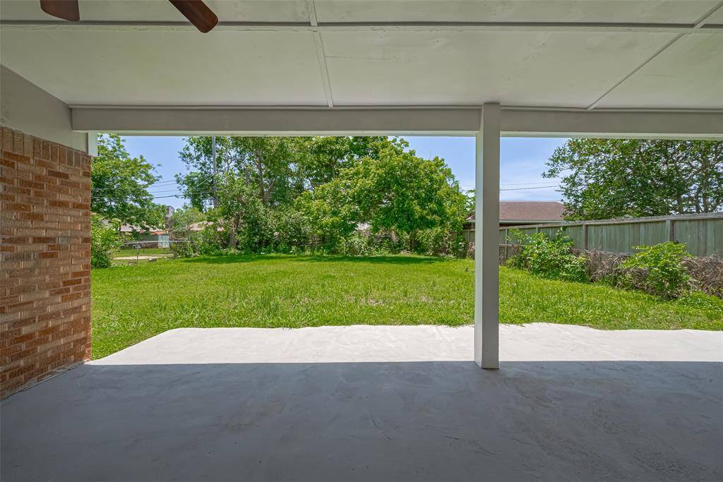 From the patio, enjoy a view of the lush backyard — a peaceful and private extension of your living space.