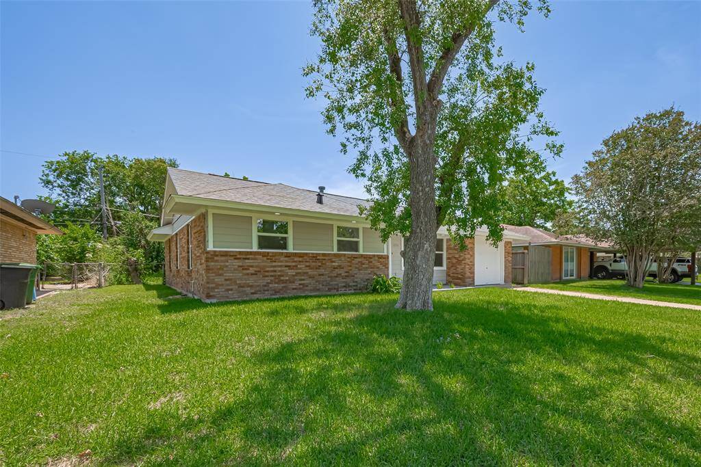 A broader view from the side shows the ample setback from the neighboring property, adding privacy and open space.