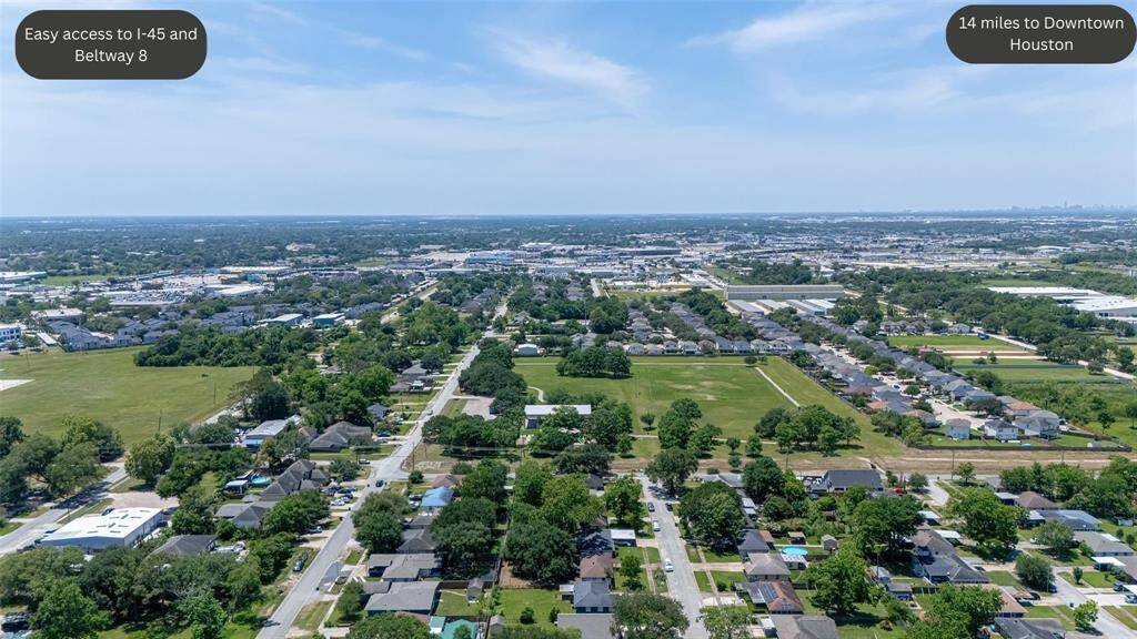 A sweeping aerial of the neighborhood places the home within its broader context — with convenient proximity to local schools, parks, shopping, and major thoroughfares.