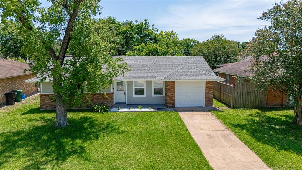 With a welcoming curb appeal, the property features a well-maintained exterior and a spacious layout designed for modern living.