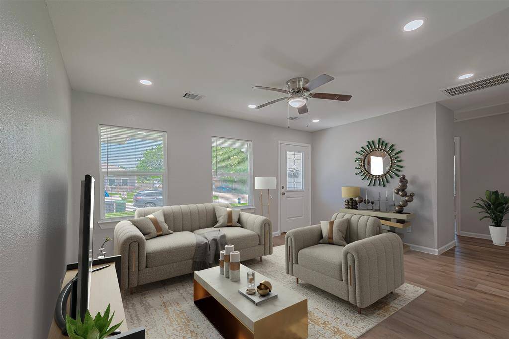 Step through the front door into a bright and welcoming living space, where large windows bring in natural light. *virtually staged**