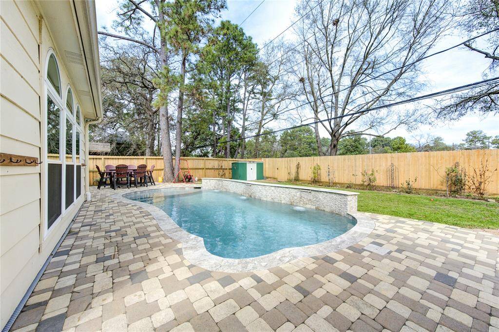 This photo showcases a spacious backyard, a privacy fence that was replaced in 2017 & 2024 and more room for the family to play.